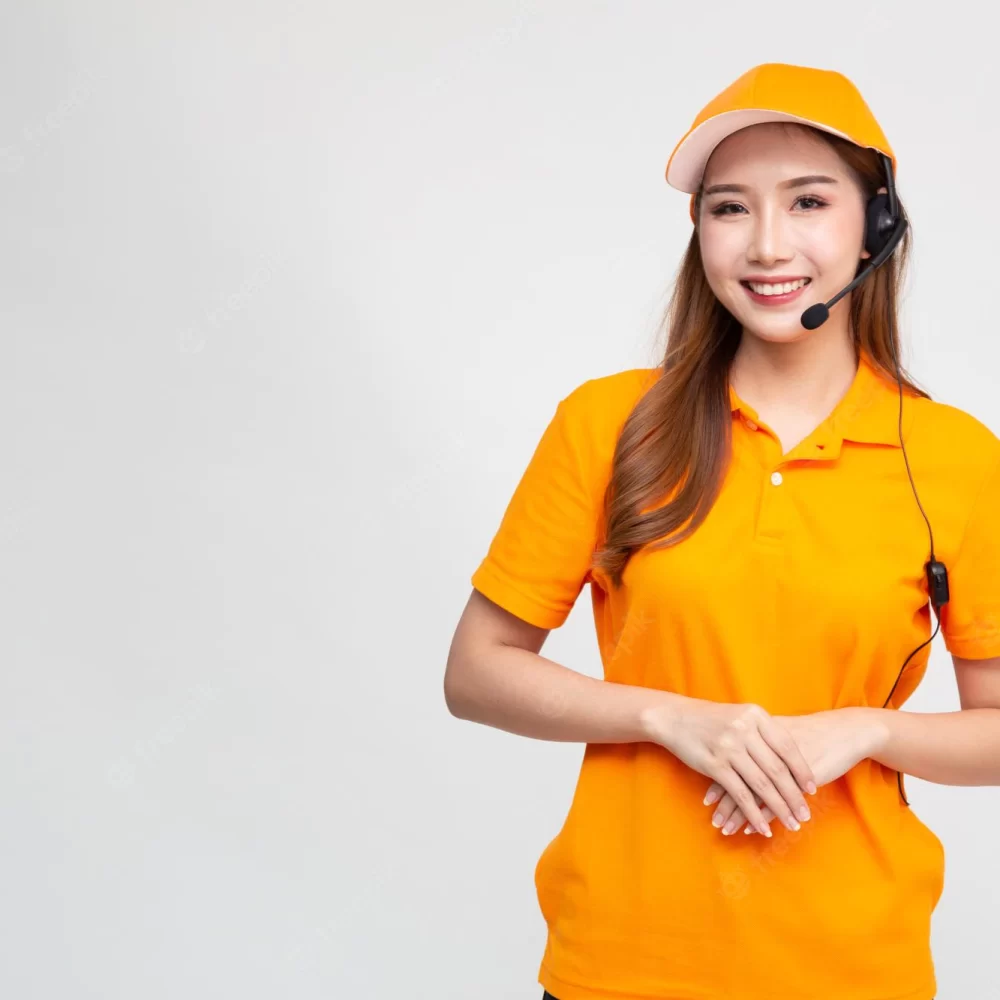 portrait-happy-smiling-asian-woman-telemarketing-operator-orange-delivery-uniform-with-headphone-isolated-white-ba80